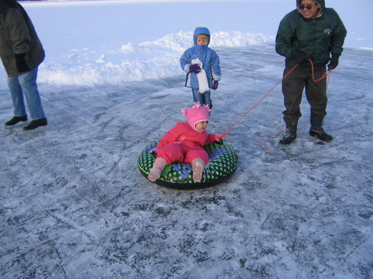 Getting pulled around by grandpa... we took our turns...