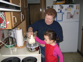 Making frosting for the gingerbreadman!