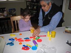 Novali and Tamara came to Michigan. Right away Novali wanted to play PlayDough with Grandpa. 