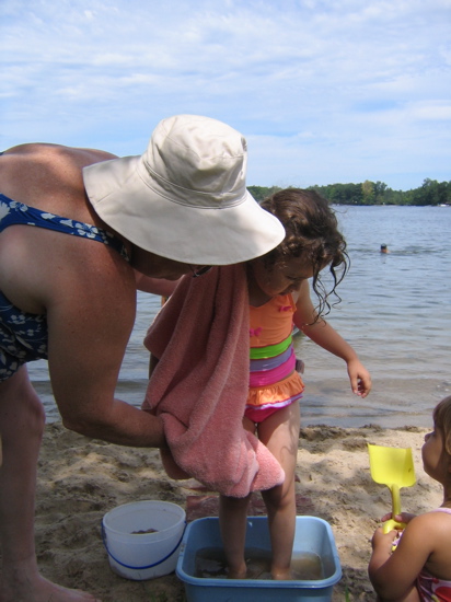 She always has to rinse the sand off. 