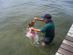 Jumping off the dock into the water. 