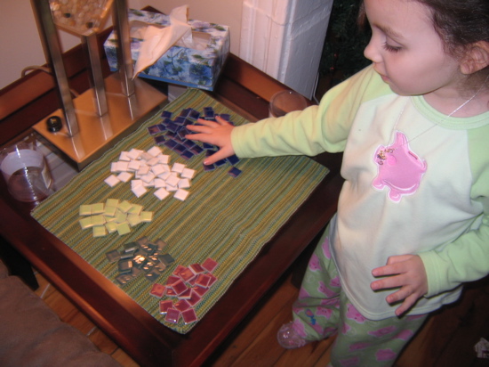 Santa brought her mosaic tiles to decorate the table.