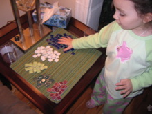 Santa brought her mosaic tiles to decorate the table.