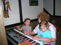 Grandma giving piano lessons.