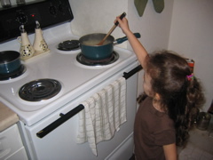 Stirring the pasta.