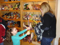 Novi was trying to scare Heather in the gift store. 