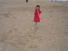 So proud of her name in the sand.