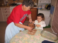 Novi and my grandma baking. 