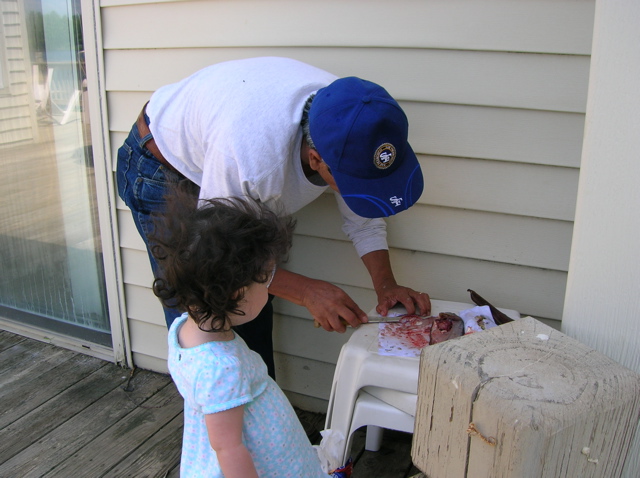 Ayanna helping to clean the fish...