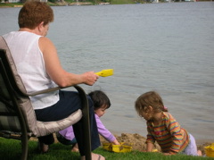 Grandma helping with the sandcastles.