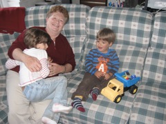 Everyone waiting to eat and playing with grandma. 