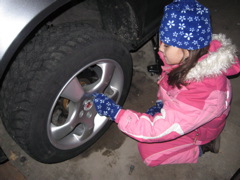 Putting the lugs back on... look at that winter tire tread!