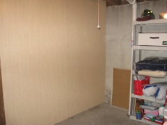 We got the paneling (bamboo look) nailed up... still need one more piece (on the left).