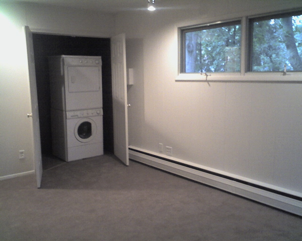 Laundry was moved to the first floor in the den/bedroom. Only room in house with carpet. 