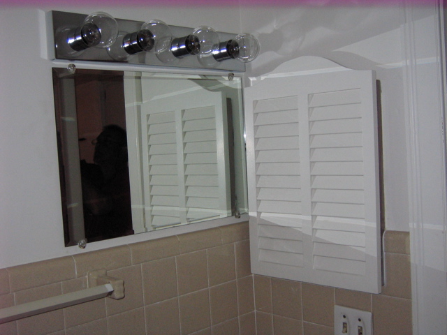 Vanity above sink.