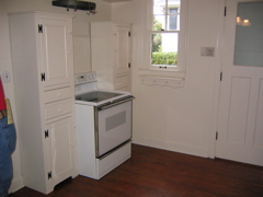 In the kitchen... range and some movable cabinets. 