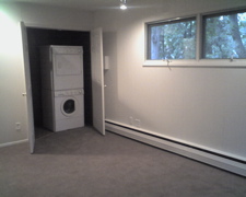 Laundry was moved to the first floor in the den/bedroom. Only room in house with carpet. 