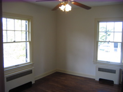 Cieling fan and two windows. 