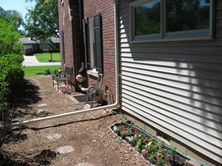 New path, mulch, flowers and trying to grow Hydrangeas and rose bushes. 