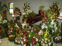 By the next morning you could barely see the casket there were so many flowers.