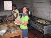 The girls make the food for the entire mission. 