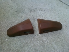 Brown strut tower seat belt covers. 