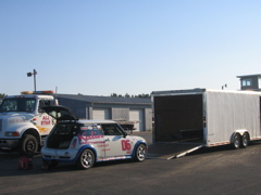 Lots of fast cars on trailers.